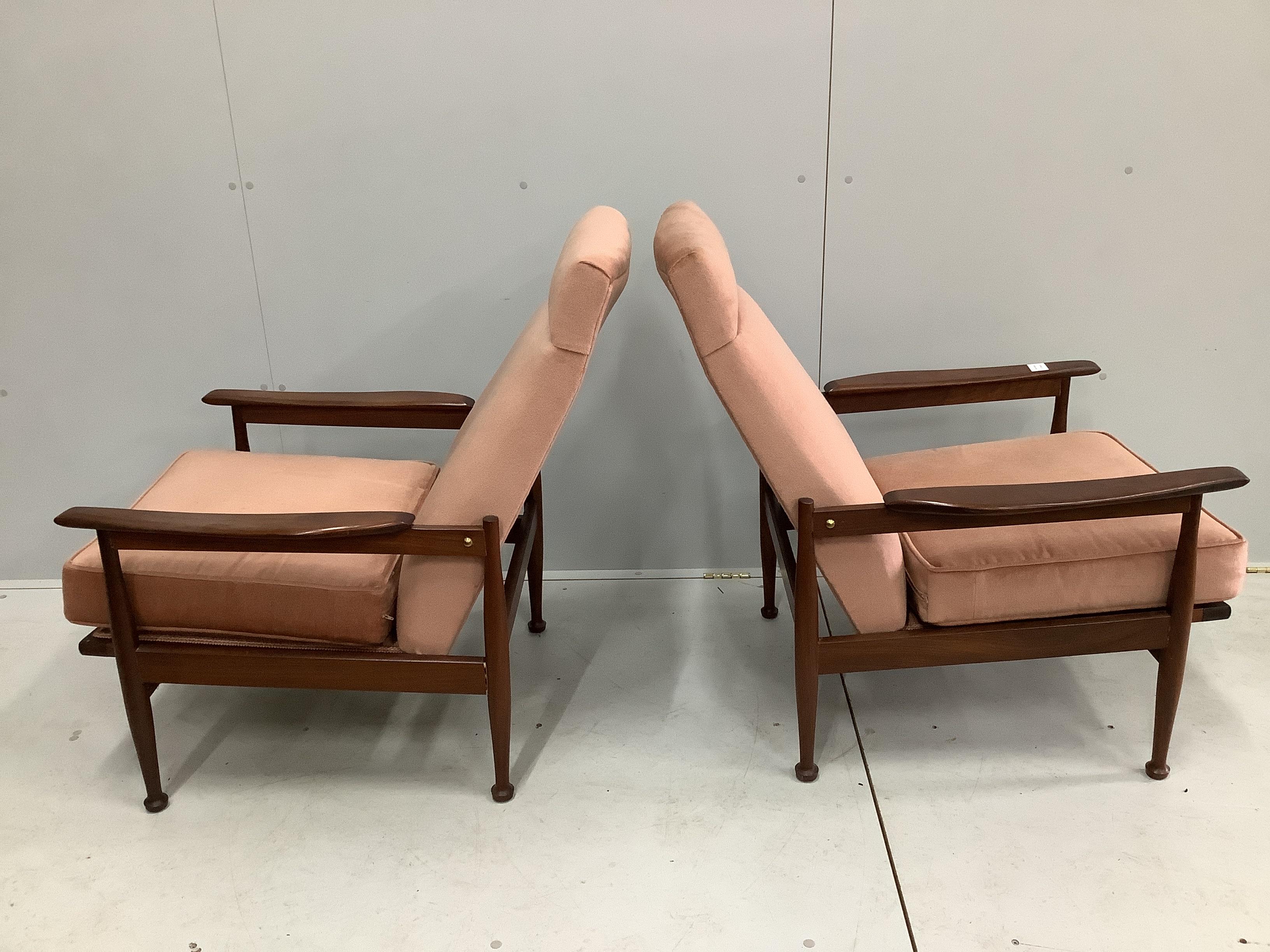 A pair of mid century Danish design teak reclining armchairs, width 68cm, depth 85cm, height 90cm